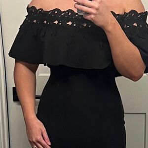 Woman’s black off the shoulder lace neckline formal dress